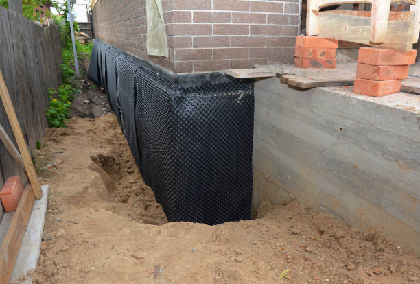 SJ Waterproofing Pros technician performing targeted Waterproofing assessment in Stockbridge, MI
